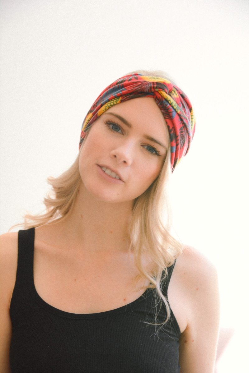 Red tropical twist headband headwrap with floral design, perfect for a chic summer look.