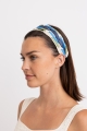 Side view of blue vibrant braided summer hair accessory.