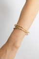 Gold Evolve layered cuff bracelet on model, fashion-forward design