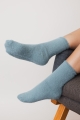 Sage ultra-soft fuzzy crew socks designed for warmth and relaxation.