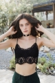 Vintage-inspired black crochet lace longline bralette with an elegant overlay design.