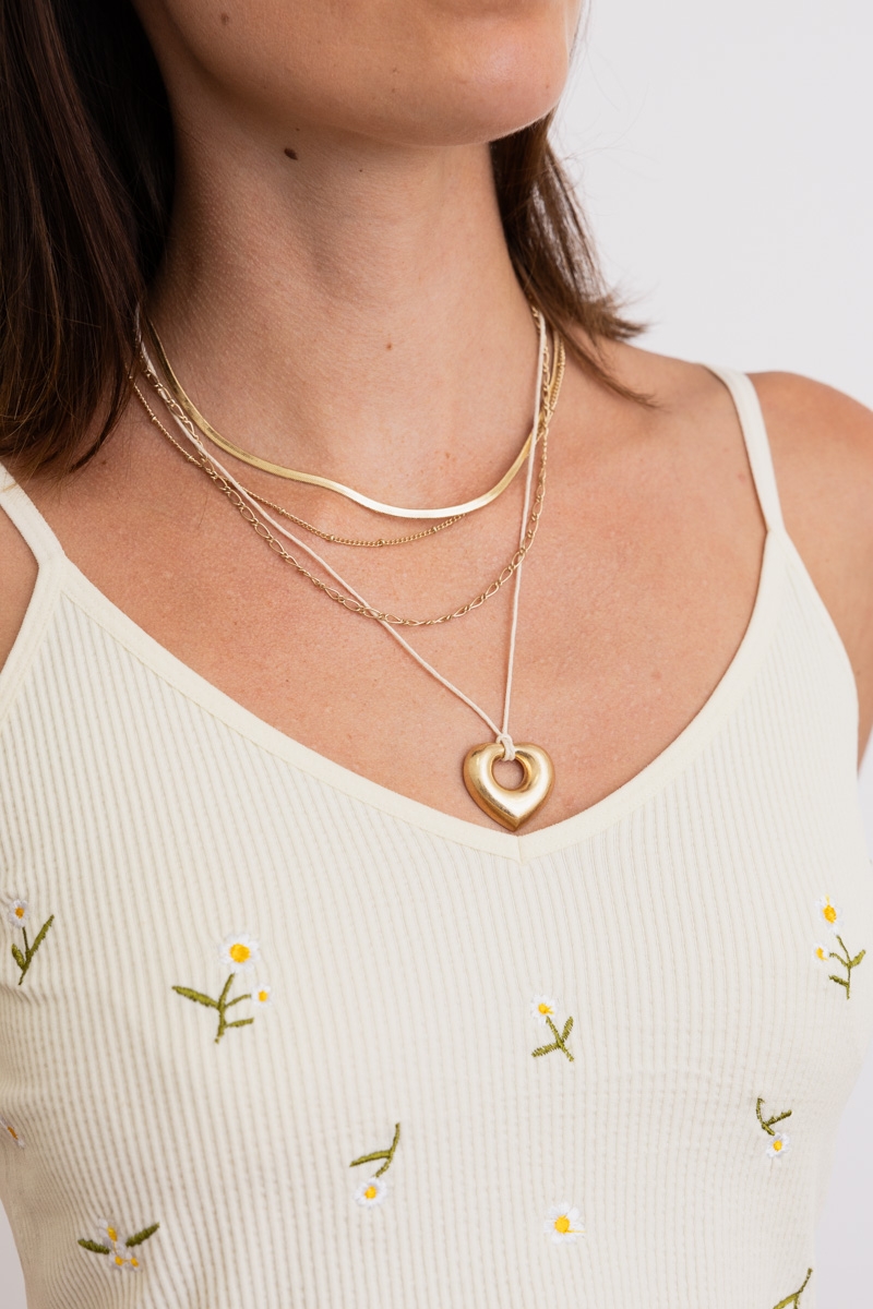 Gold Charmy Loving Heart layered necklace with romantic charm, worn by model