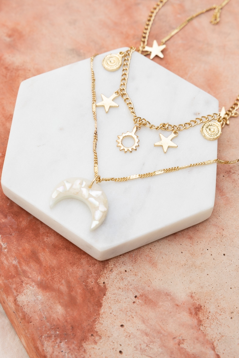 Lunar Glow Layered Necklace with a front view showcasing the moon and star design, offering a celestial charm.