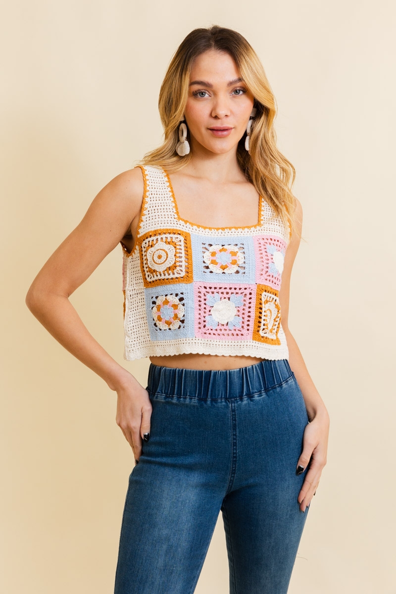Pink floral mosaic crochet top with vintage-inspired embroidery design.