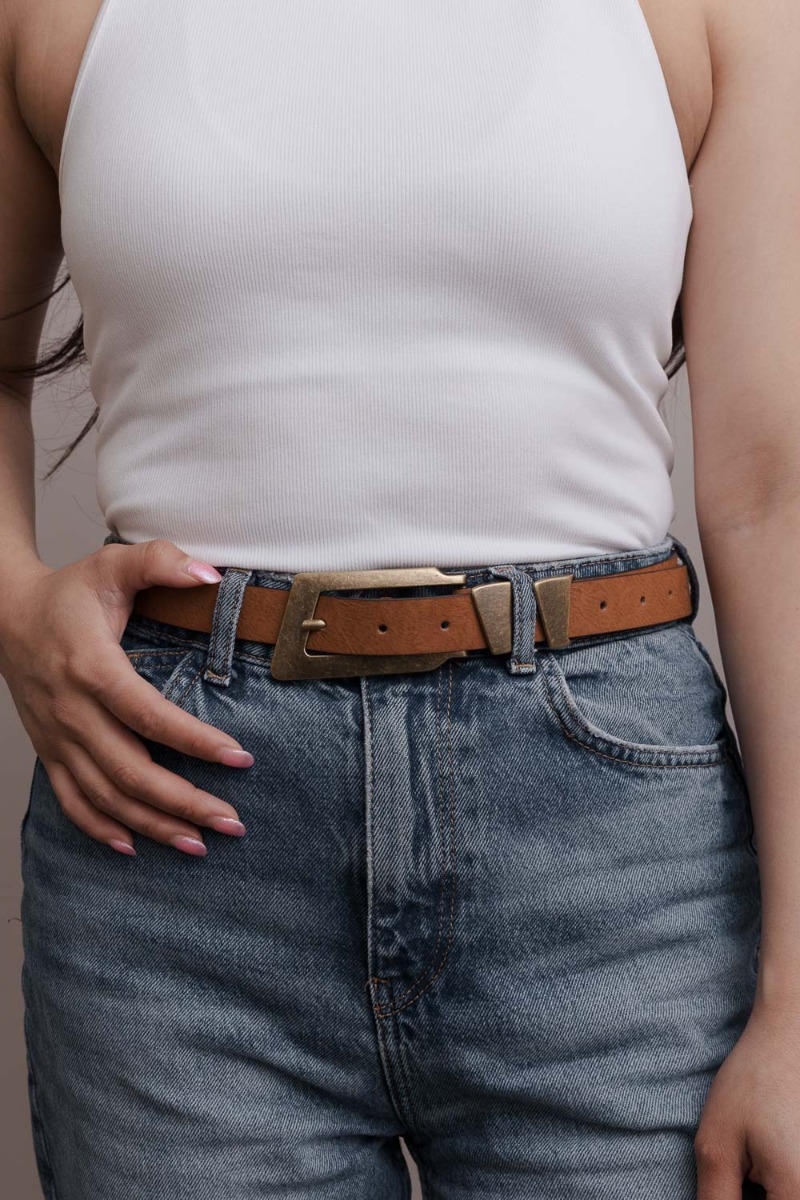 Minimalist camel vegan leather belt with rectangular buckle, sustainable fashion choice.