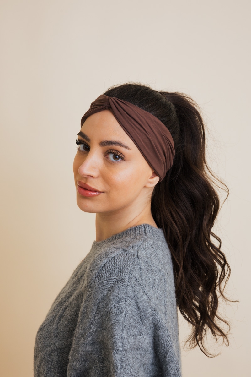 Soft ribbed knit headband in brown, stretchy and textured hair accessory for women.