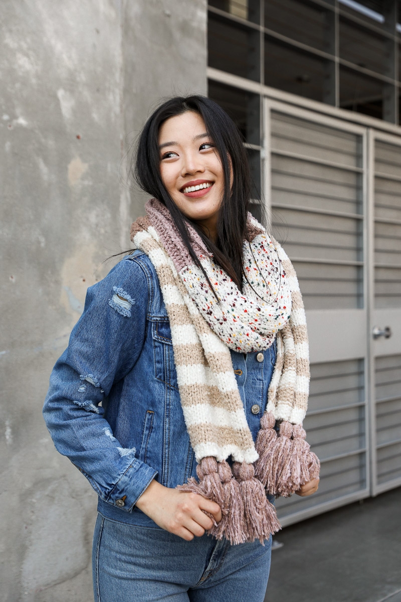 Speckle stripe tassel knit scarf featuring a lightweight and textured finish.