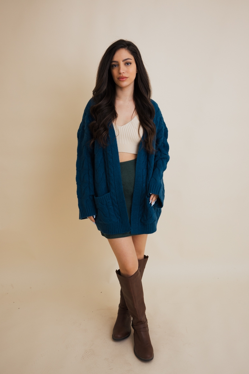 Teal cozy cable knit open front cardigan with relaxed fit design
