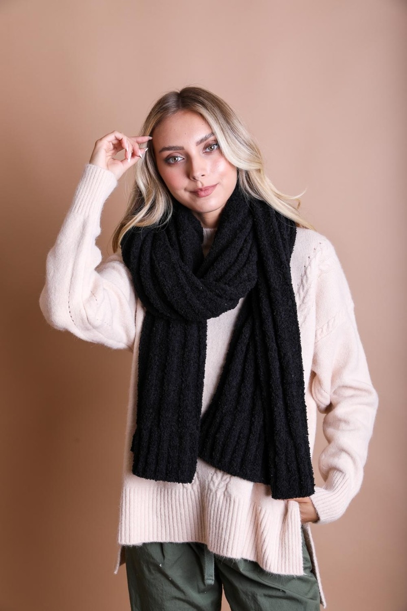 Vertical knit boucle scarf featuring ultra-soft cozy fabric, an ideal winter accessory for comfort and style.