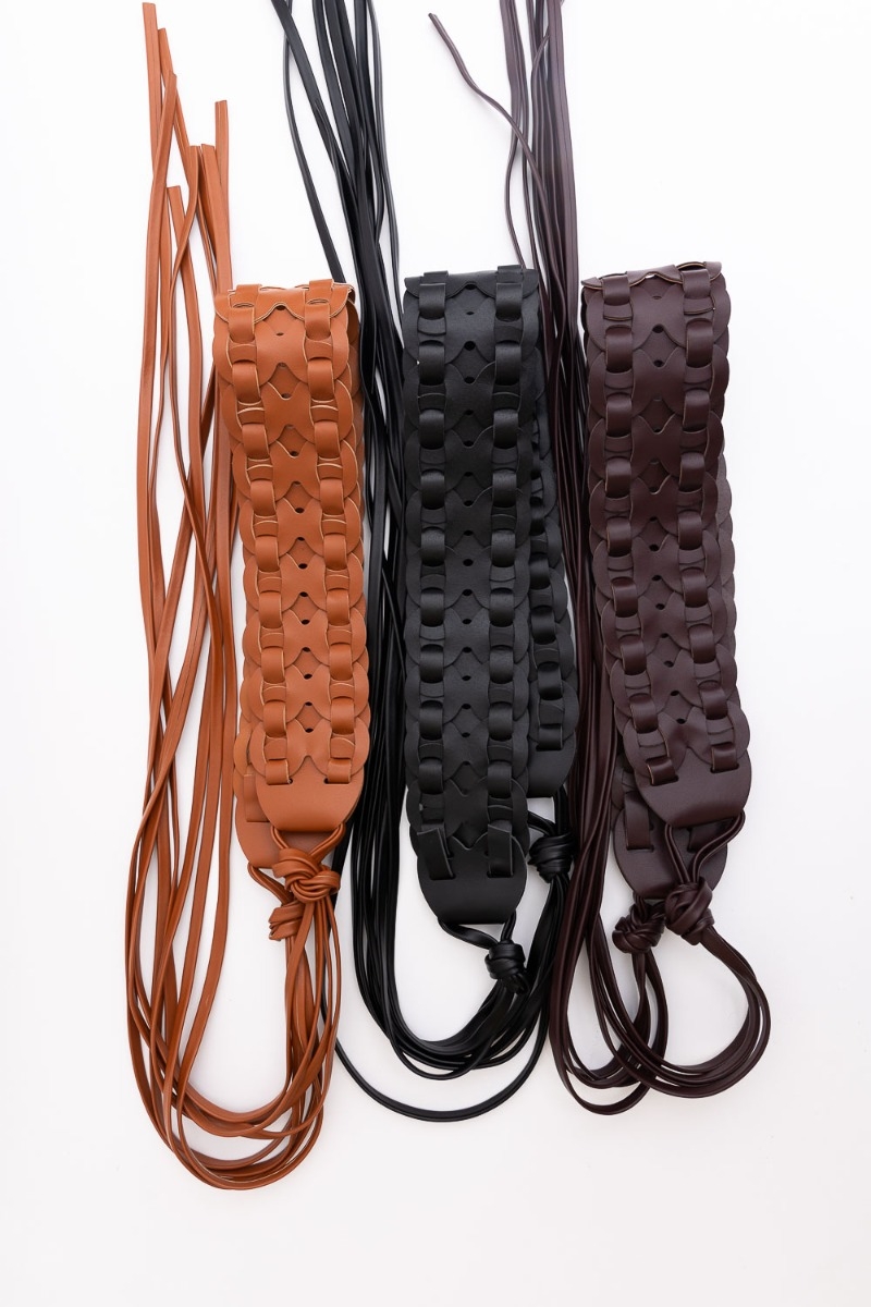 Flat lay of wide woven leather waist tie-up belt