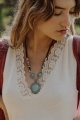Bohemian triple turquoise stone necklace with an elegant pendant design, perfect for casual wear.