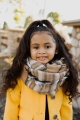 Beige flannel infinity scarf for kids, soft and cozy with frayed edges for added style.